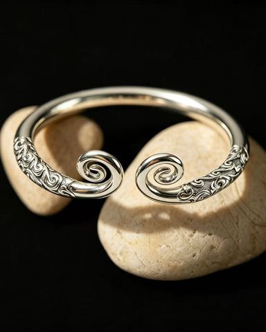 Vintage-style open cuff bracelet with scrollwork