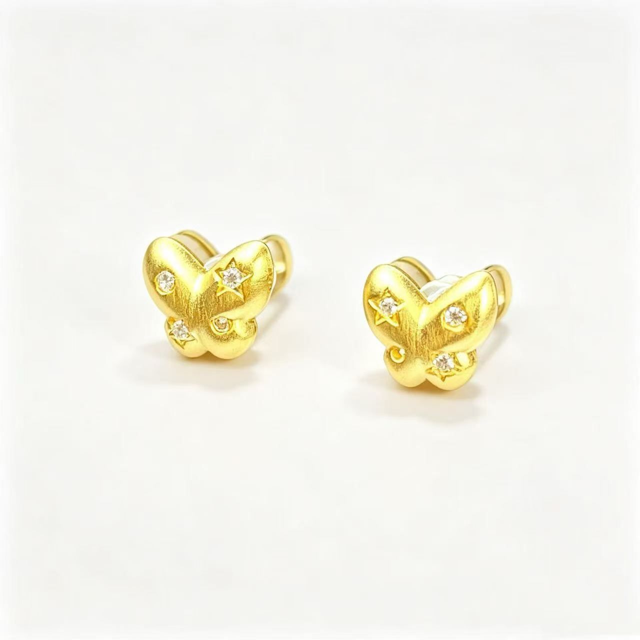 Matte star and butterfly stud earrings